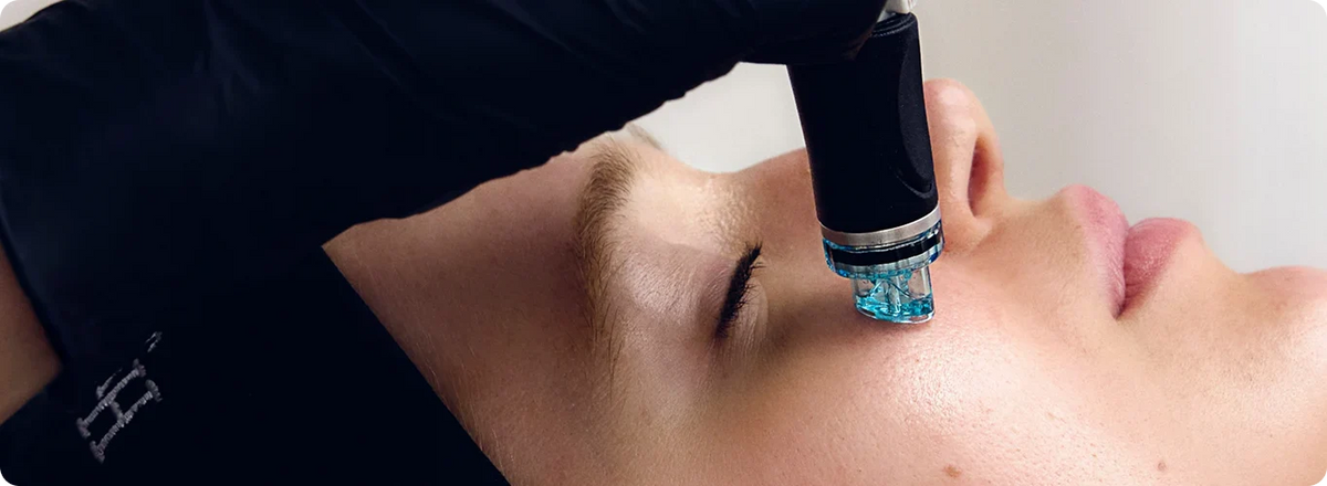 Hydrafacial handpiece treating the cheek, from official Hydrafacial photography